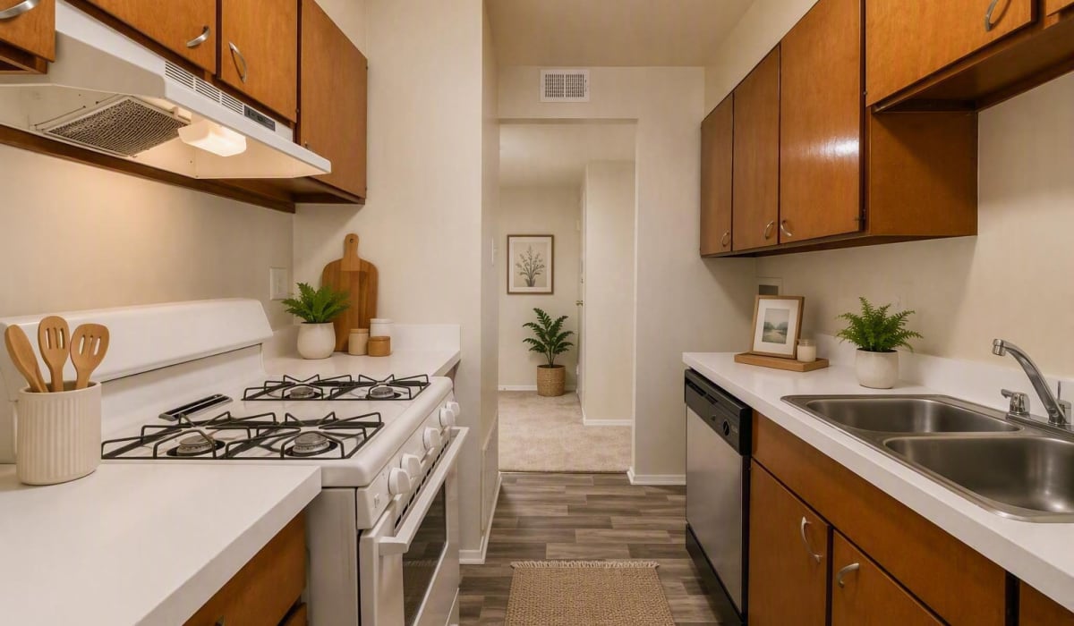 Kitchen with wooden cabinetry at Willow Oaks Apartments in Richmond, Virginia