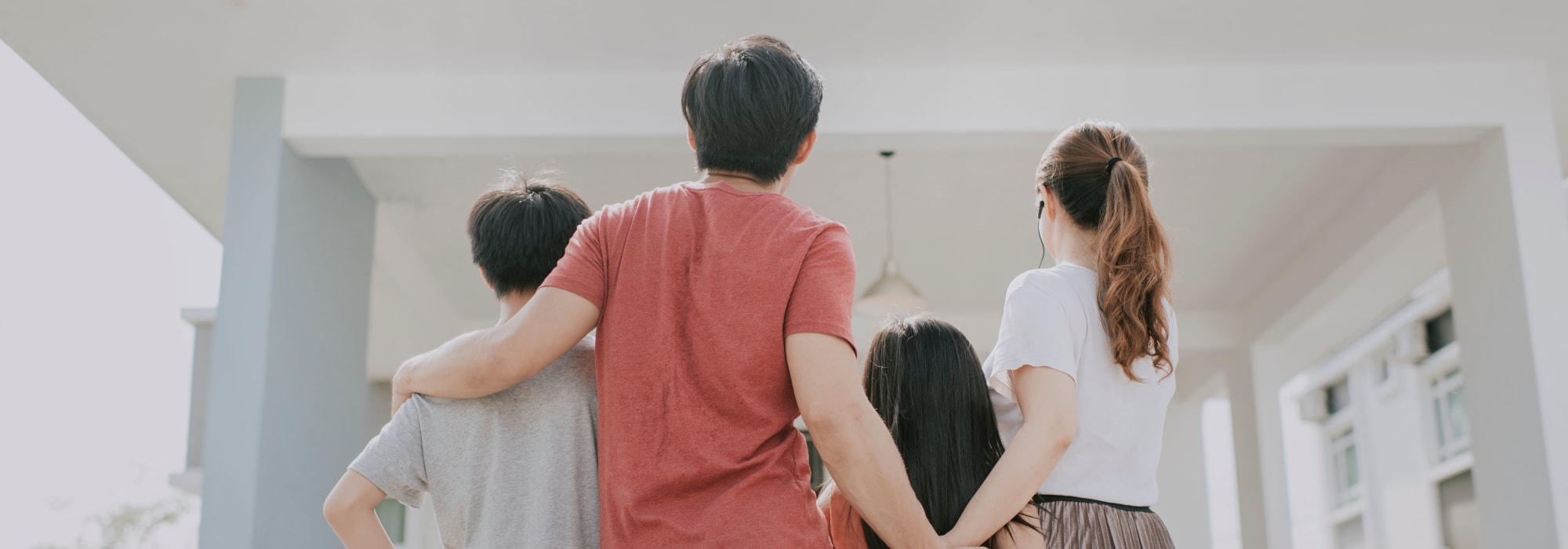 A family walking towards a home at Northwest Annex (NSA) in Chesapeake, Virginia