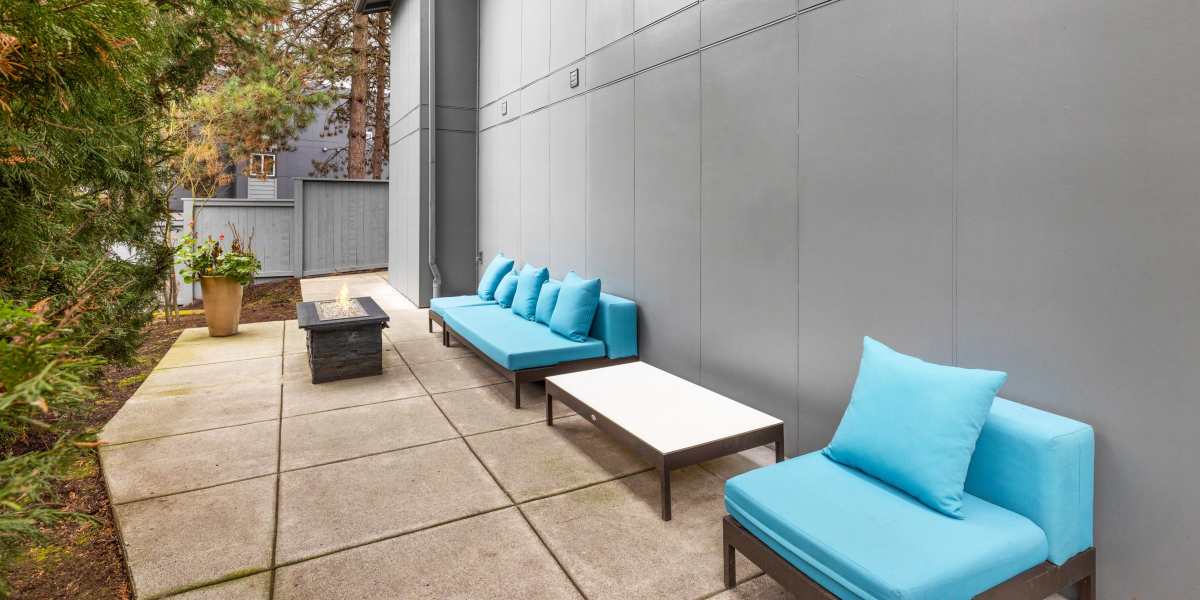 Fire pit lounge area at Karbon Apartments in Newcastle, Washington