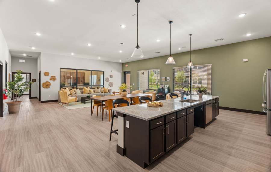 Clubhouse kitchen with seating island at Walnut Springs in Seguin, Texas
