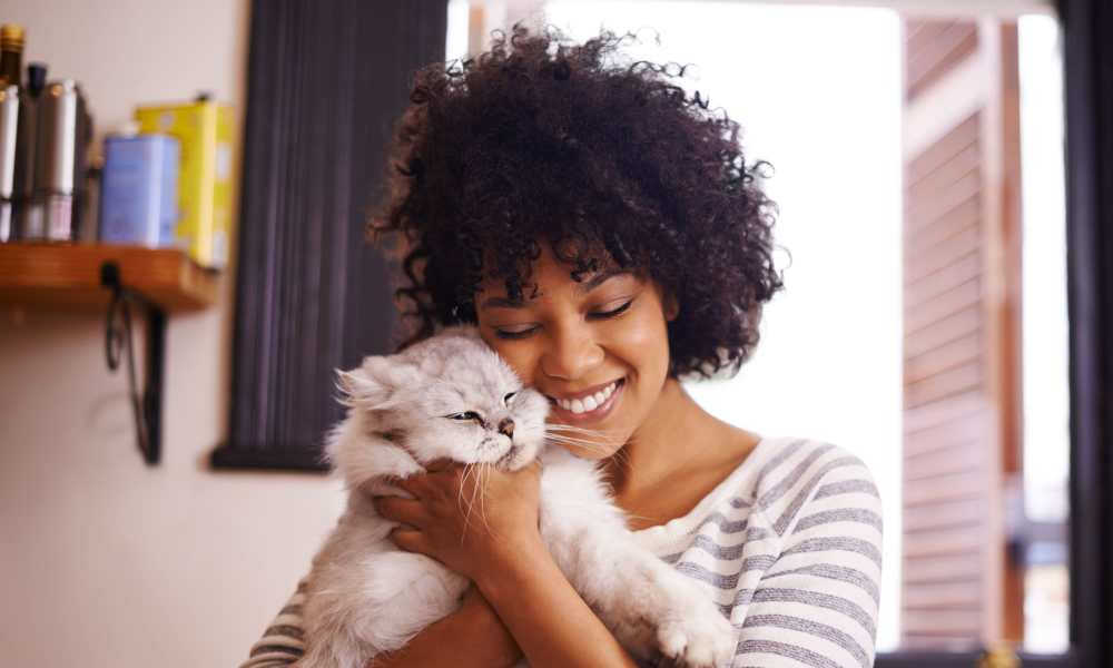 Resident petting her cat at Avonlea Creekside in Marietta, Georgia