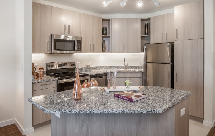 Beautiful gourmet kitchen with granite countertops in a model resident home at All Seasons Ann Arbor in Ann Arbor, Michigan
