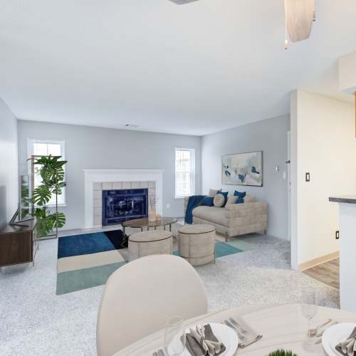 Living room with fireplace at The Lakes of Schaumburg Apartment Homes in Schaumburg, Illinois