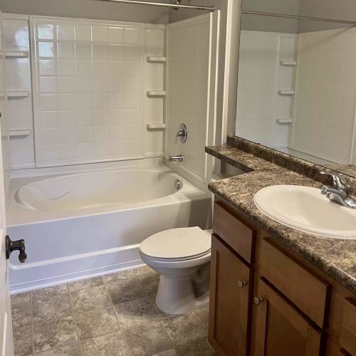 Bright bathroom with vanity and contemporary fixtures at Haven at Wild Dunes in Newport, North Carolina