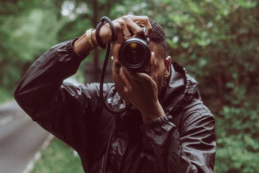 Man capturing with his camera at St. Albans Lofts in Raleigh, North Carolina,
