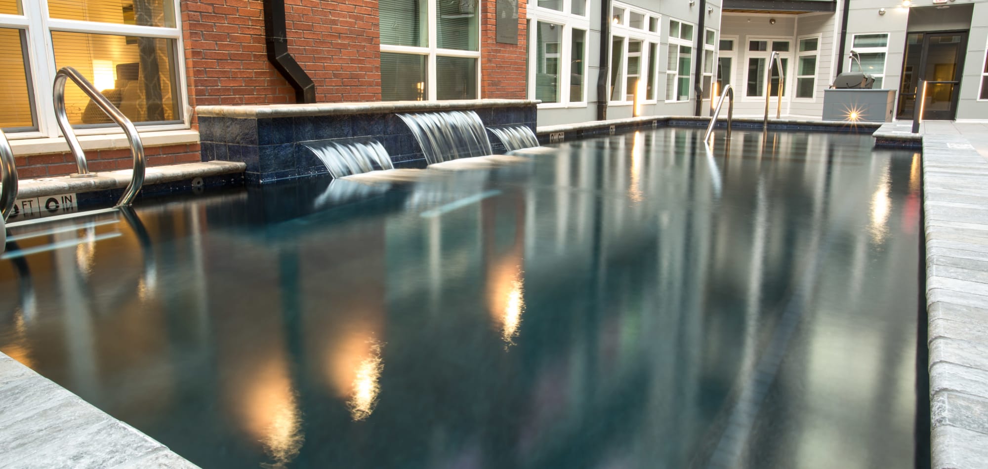 Pool with waterfalls at Attain Downtown, Norfolk, Virginia