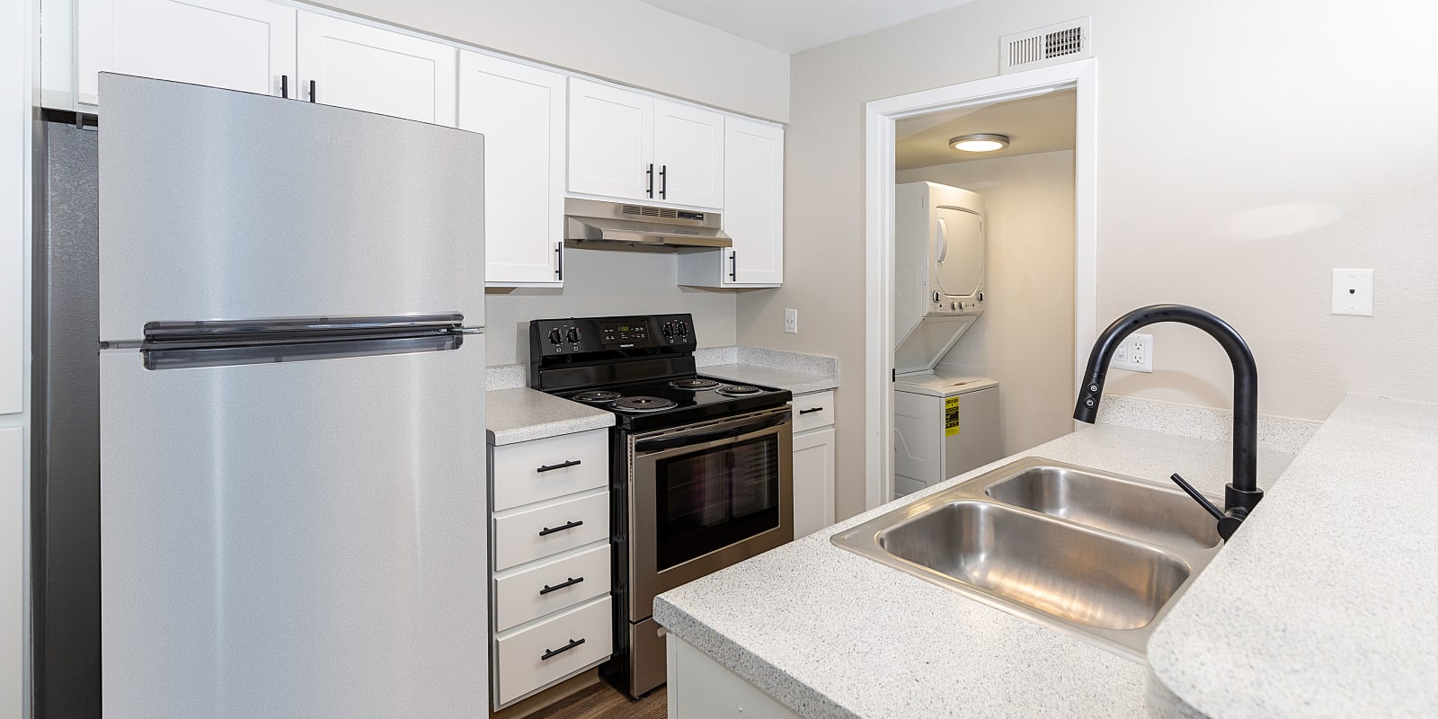 Modern kitchen at Springs of Country Woods Apartments in Midvale, Utah