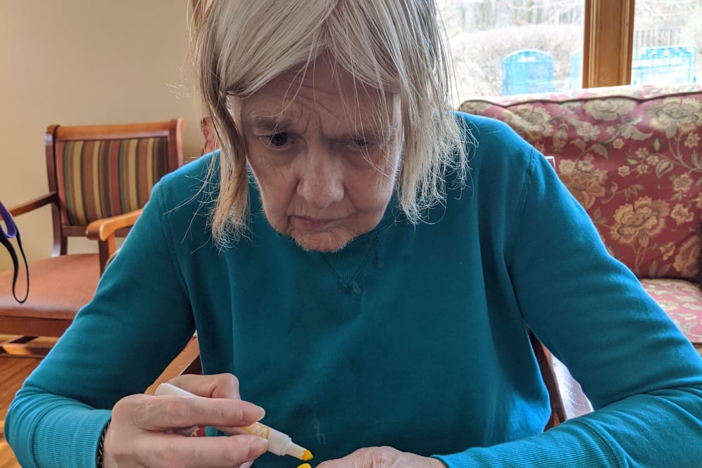 Resident drawing with markers at Ramsey Woods in Cudahy, Wisconsin.
