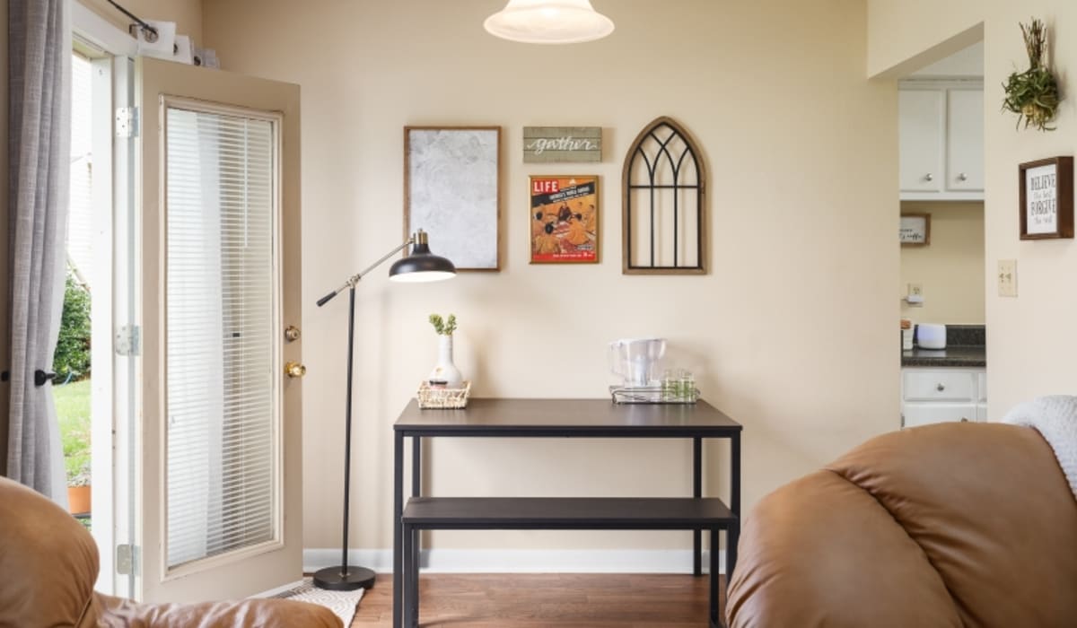 Wood-style flooring in an apartment with a private patio at Ivy Green at the Shoals in Florence, Alabama