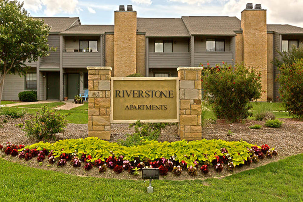 Exterior community sign at Riverstone Apartments in Bryan, Texas
