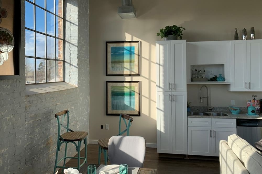 A large window in an apartment kitchen at Bellevue Mill in Hillsborough, North Carolina