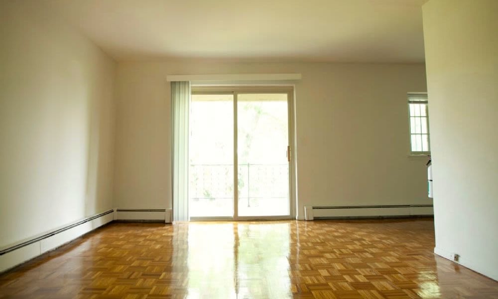 Living room with patio access at Glen Wall Heights in Wall Township, New Jersey