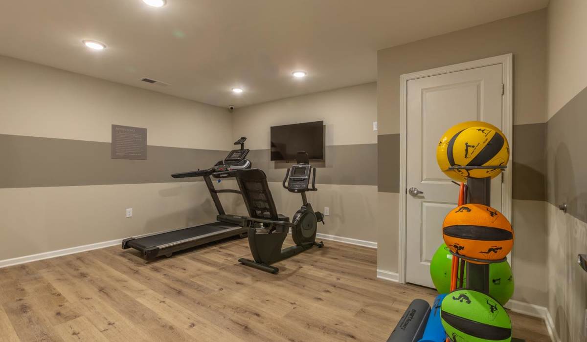Fitness center with tv at Clemons Greene in Lexington, South Carolina