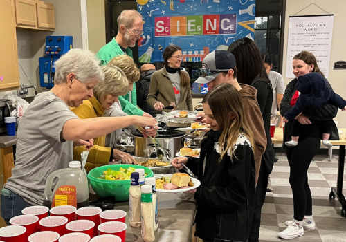 Senior residents serving food at Homestead Oaks Apartments in Austin,Texas 