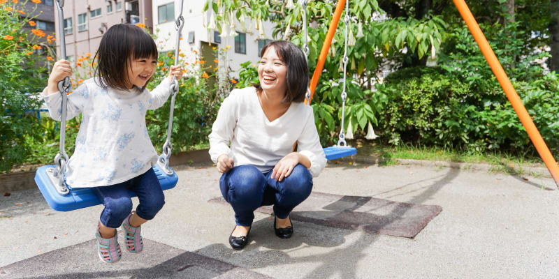 A child and mother playing at a school near Midway Manor in Virginia Beach, Virginia