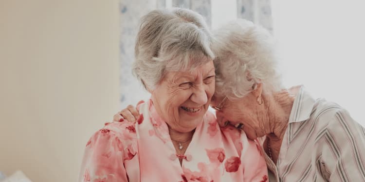 Residents laughing at Mill Hill Residence in West Yarmouth, Massachusetts