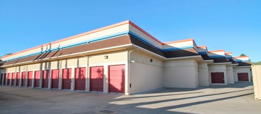 Outdoor storage units with a wide driveway at A-1 Self Storage