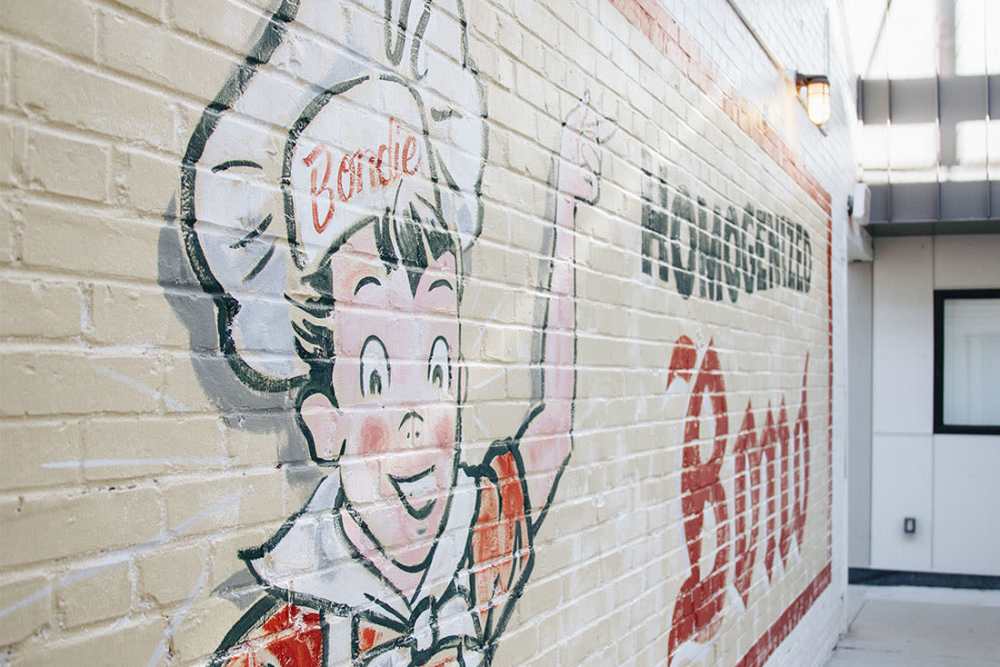 Colorful mural on brick wall at Courtyard Lofts at Scott’s Addition in Richmond, Virginia
