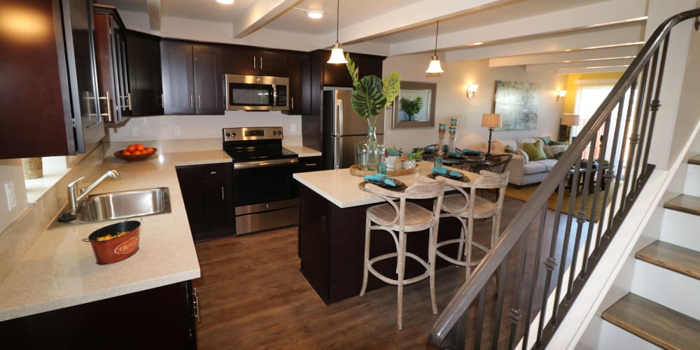 Large kitchen with an island with seating at Ramblewood Apartments in Fremont, California