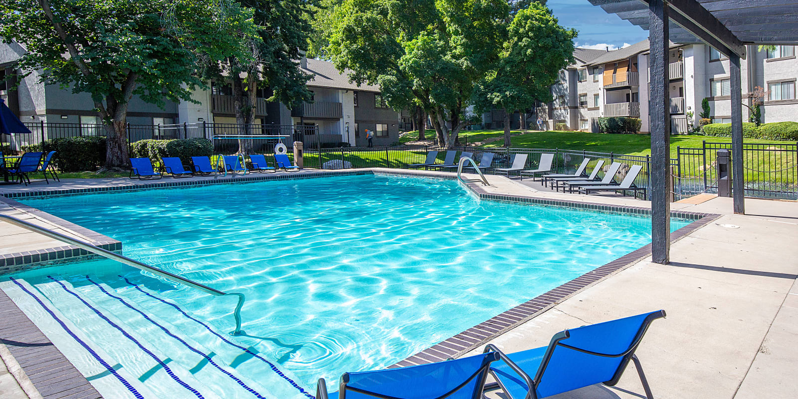 Outdoor pool at Springs of Country Woods Apartments in Midvale, Utah