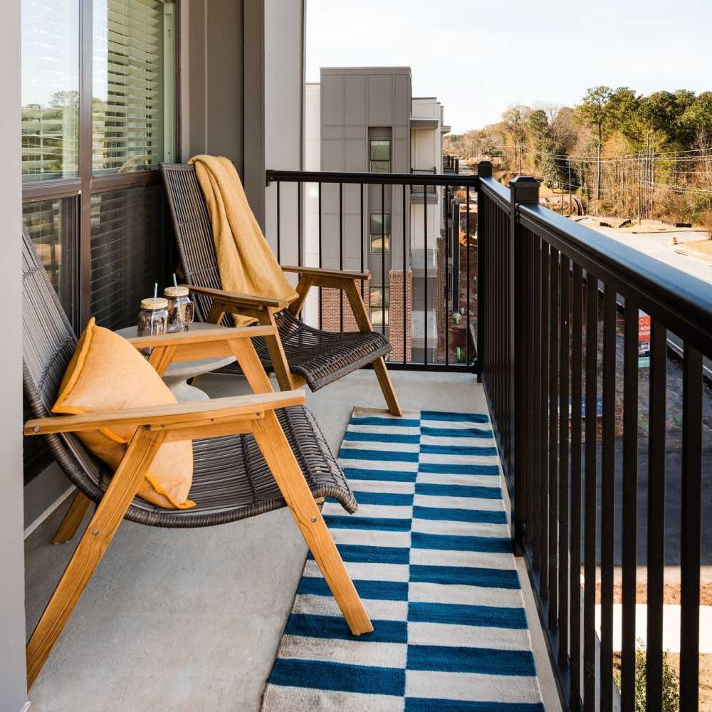 A charming balcony with two chairs at Siena Suwanee Town Center in Suwanee, Georgia