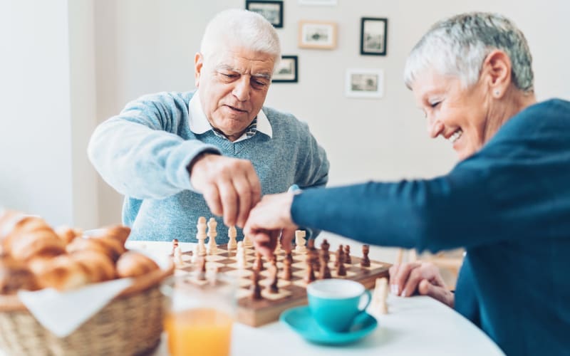 Residents playing chess at Grand Villa of St. Petersburg in St. Petersburg, Florida