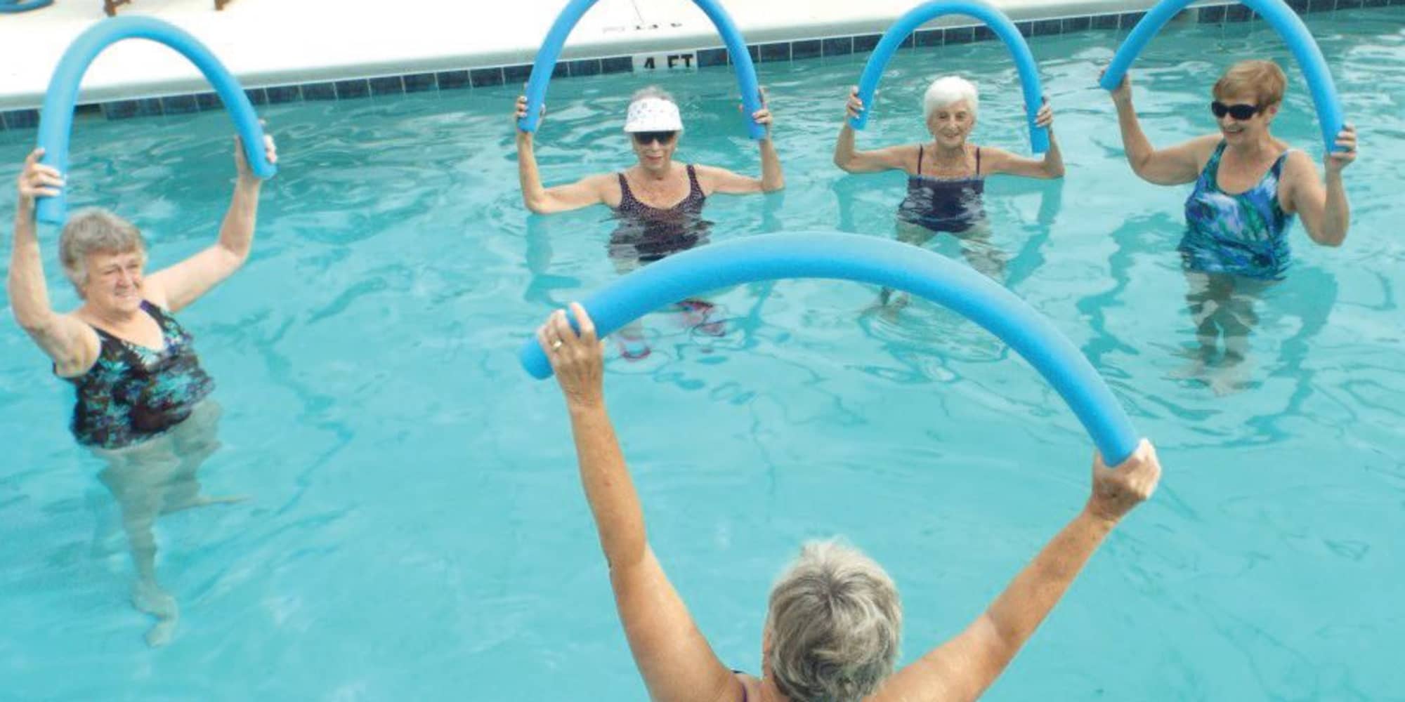 Residents exercising in the pool at Salishan Gracious Retirement Living in Spring Hill, Florida