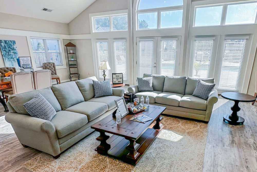 Resident clubhouse lounge with comfortable seating at Brittany Place of Rock Hill in Rock Hill, South Carolina