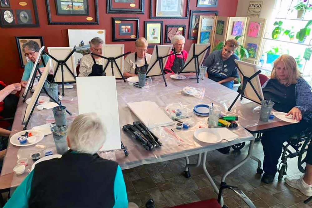 Residents painting at Peachtree Village Retirement Community in Roswell, New Mexico.