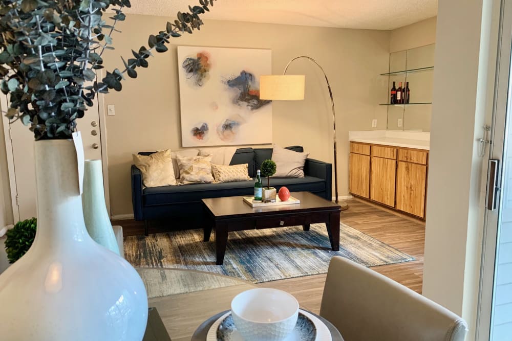Living room with couch and coffee table at Oak Ridge Apartments in San Antonio, Texas