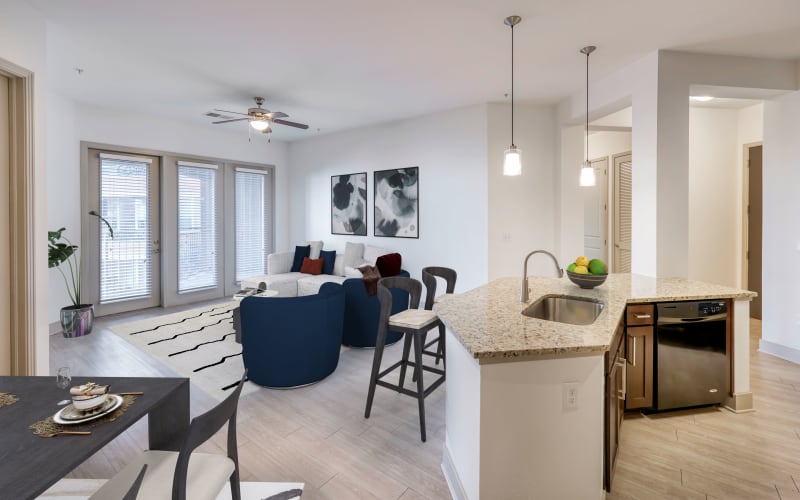 The dining room, living room with large windows at Helios in Englewood, Colorado