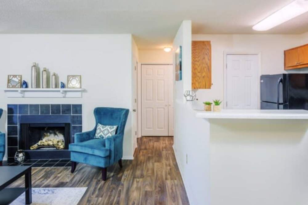 Living room with a view of kitchen at The Kelston in Charlotte, North Carolina