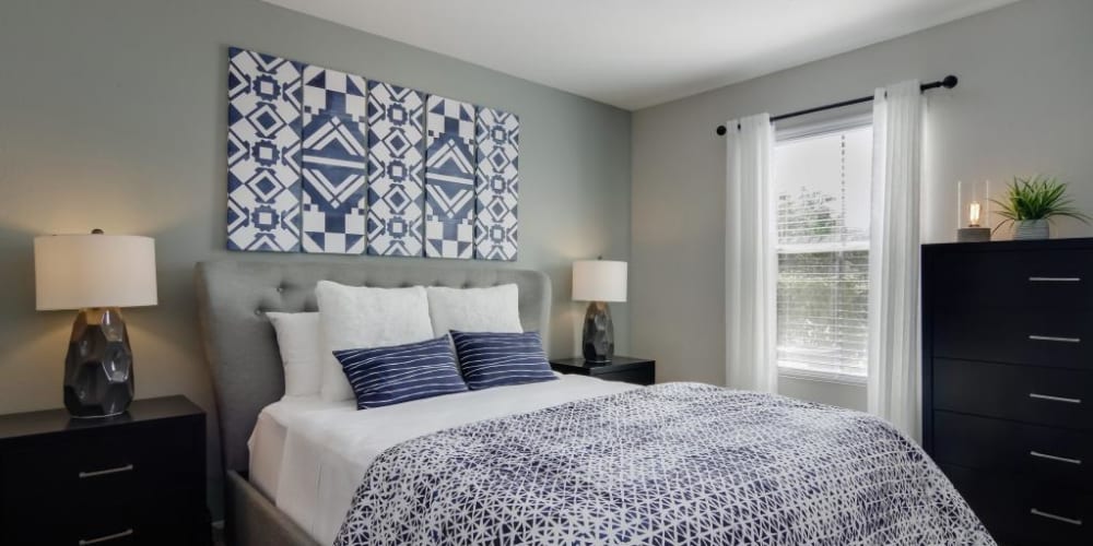 Bedroom decorated in a model home with lots of light at The Landings at Steeplechase in Houston, Texas