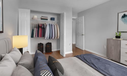 A spacious bedroom with an open closet at Five7Five in Austell, Georgia