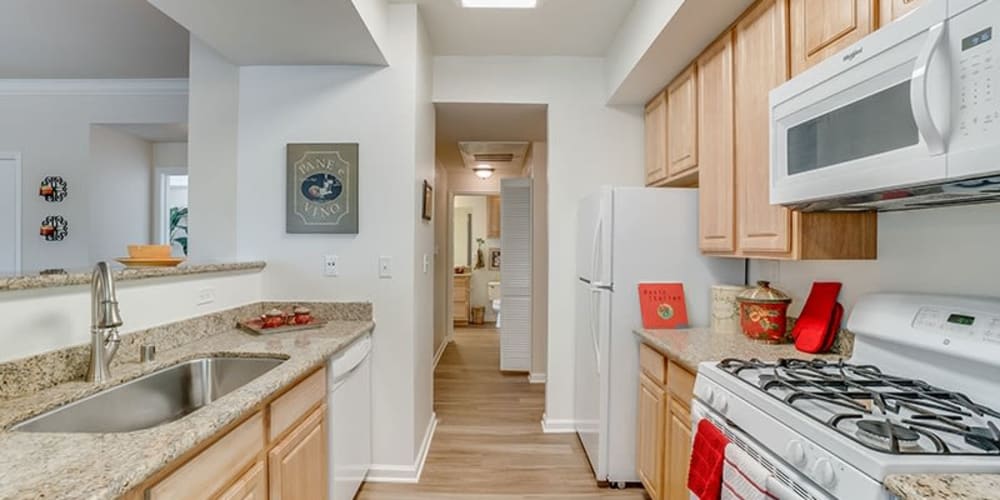 Kitchen with wood-style cabinets at Bella Rose in Antioch, California