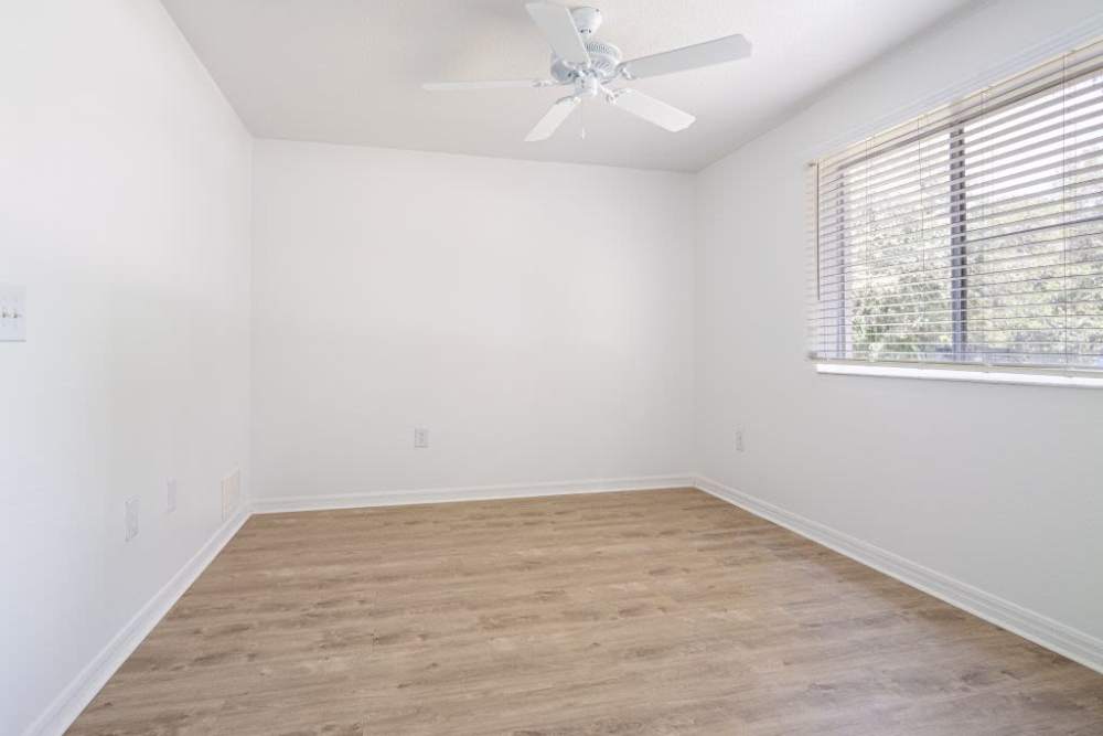 Unfurnished bedroom with large window at Cypress Oaks in Leesburg, Florida