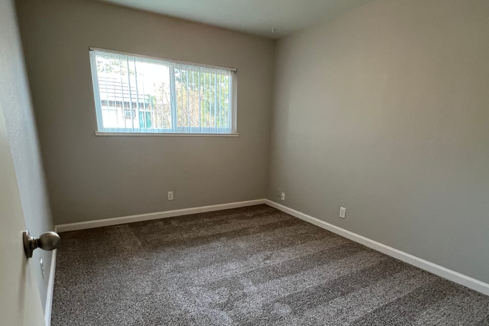 Spacious spare bedroom at Westwood Village Apartments in Manteca, California  