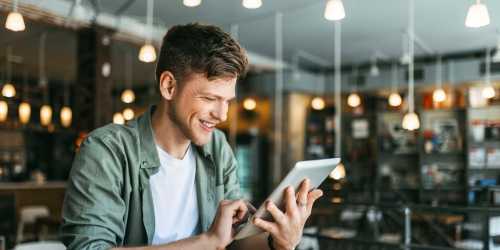 Resident enjoying delicious coffee in the neighborhood near Terrace View Apartments in Fresno, California
