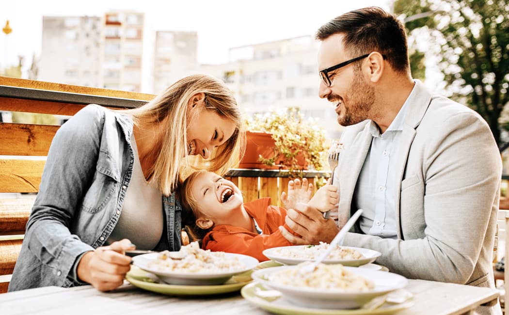 Family Having Breakfast in model home at Willow Oaks Apartments in Chesapeake, VA
