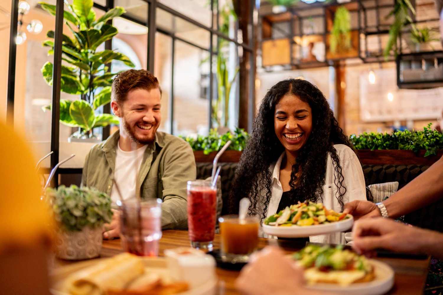 Couple eating at a restaurant near Strata Apartments in Denver, Colorado
