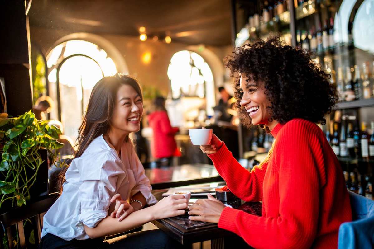 Charming café atmosphere with warm sunlight pouring in, perfect for intimate conversations at High Point Crossing Apartments in Augusta, Georgia.