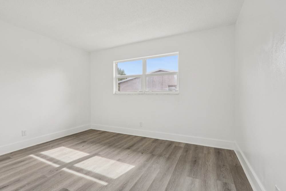 Well-lit room of an apartment at El Jardin Apartments in Hollywood, Florida