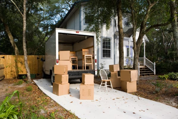 A moving truck from Castro Valley Hayward Storage in Castro Valley, California outside of a house