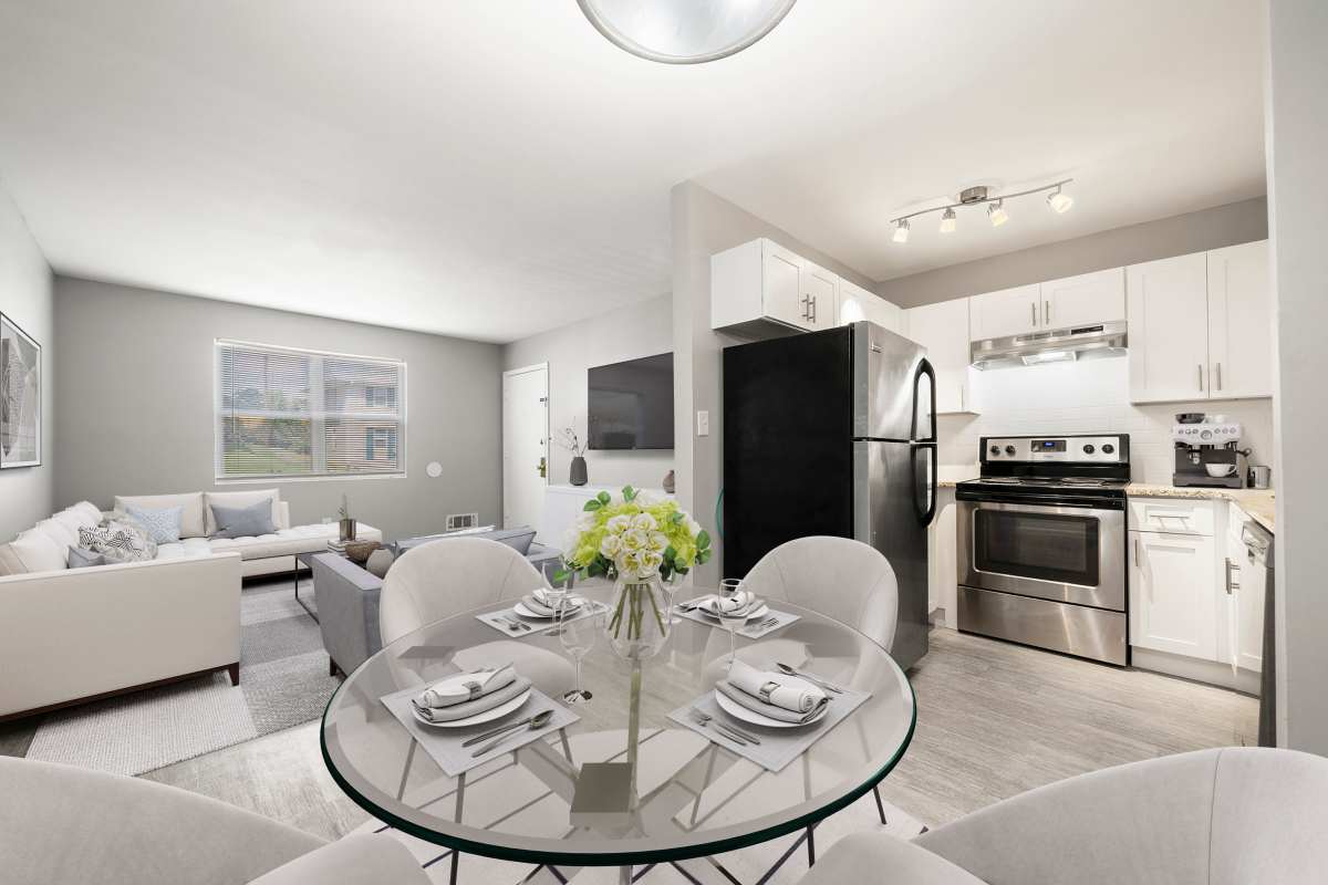 Apartment kitchen and living room at Georgian Oaks Apartments in Smyrna, Georgia