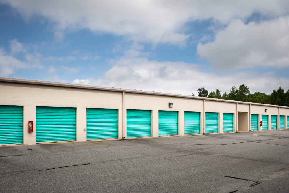 blue doors on outdoor storage units at AAA Self Storage at Landmark Center Blvd in Greensboro, North Carolina