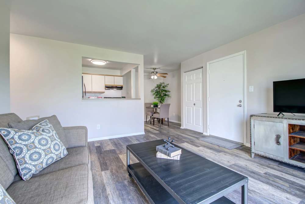 Living room coffee table, couch and view of dining area at Hidden Creek, Crown Point, Indiana