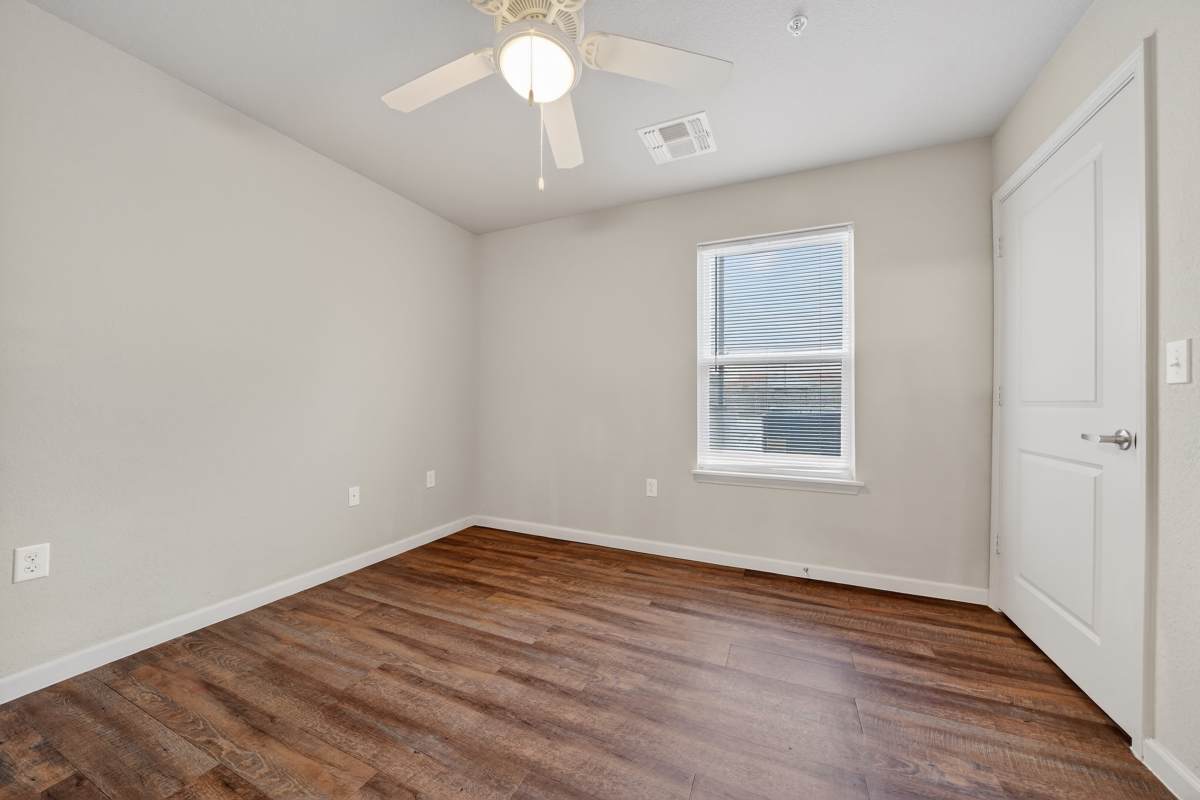Living room with a ceiling fan at Eagles Gate in Eagle Pass, Texas