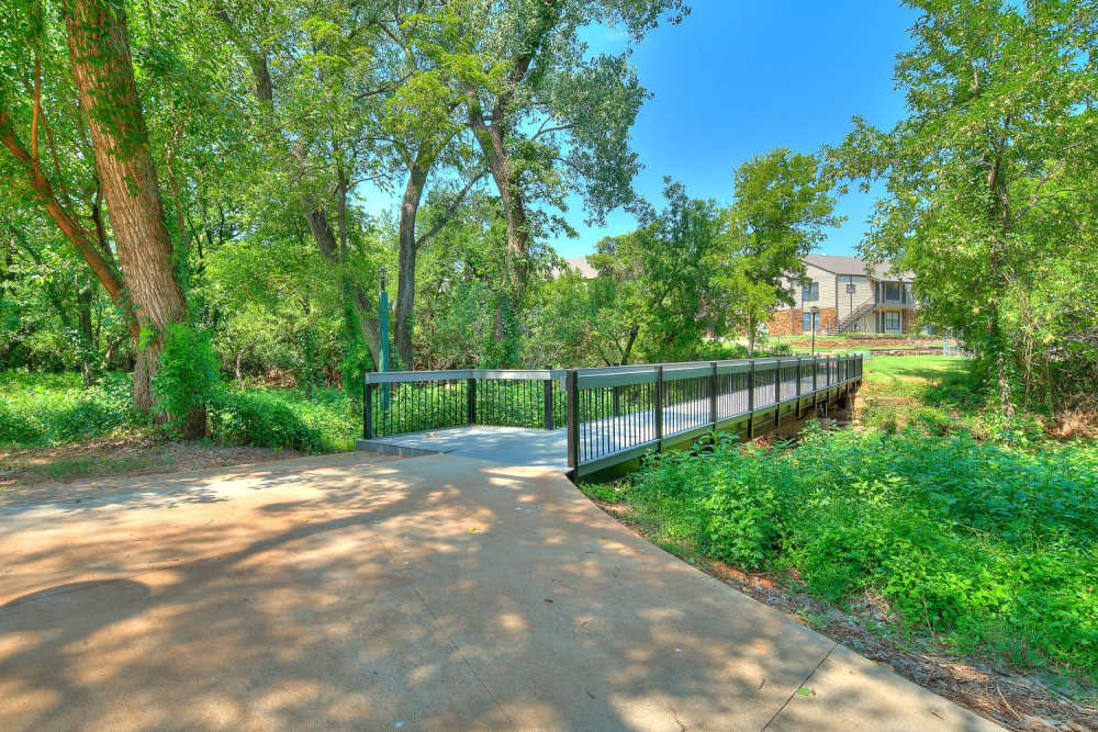 Walking trail with greenery at Stonebrook in Oklahoma City, Oklahoma