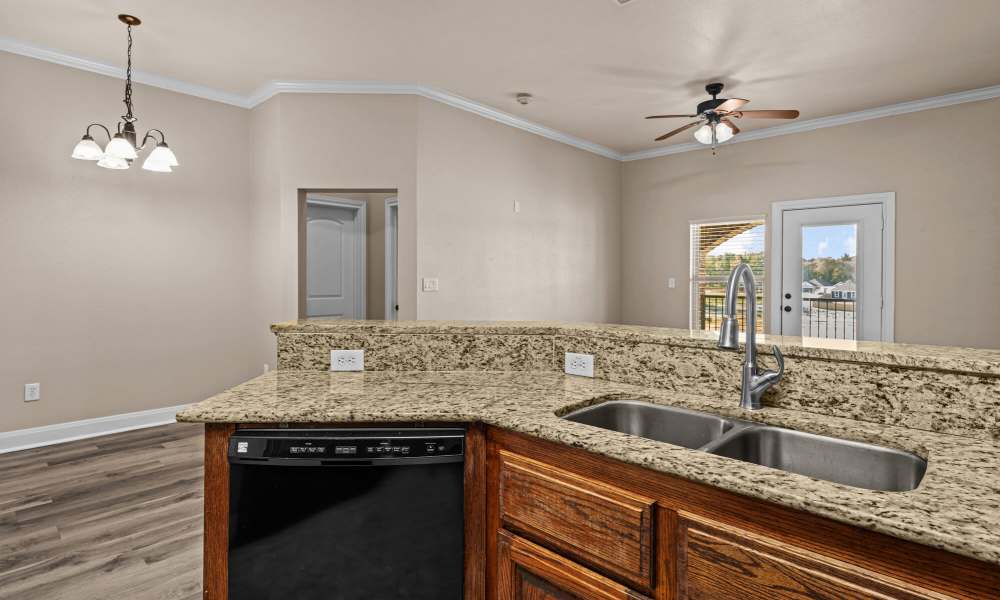 Kitchen with stainless steel sink at The Arbors of Mineola in Mineola. TX