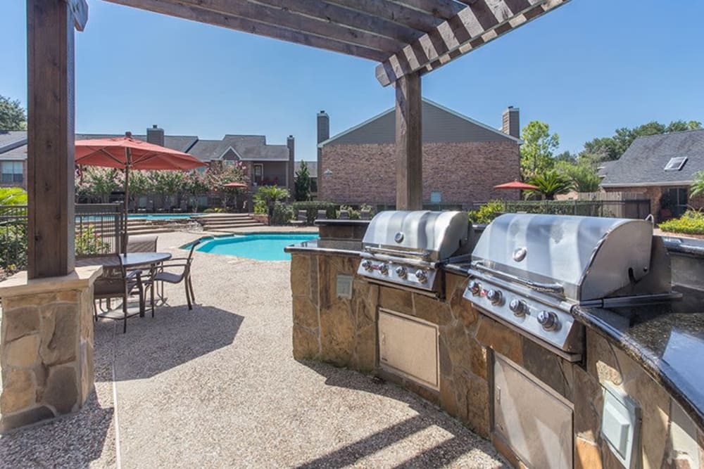 BBQ grill area by pool at Broadstone Briar Forest in Houston, Texas